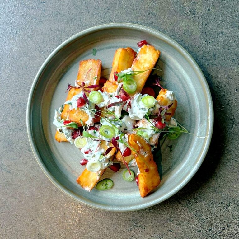 Halloumi Fries with Fresh Yogurt, Pomegranate, and Spring Onions. Showcasing our exquisite and freshly prepared small plates menu.