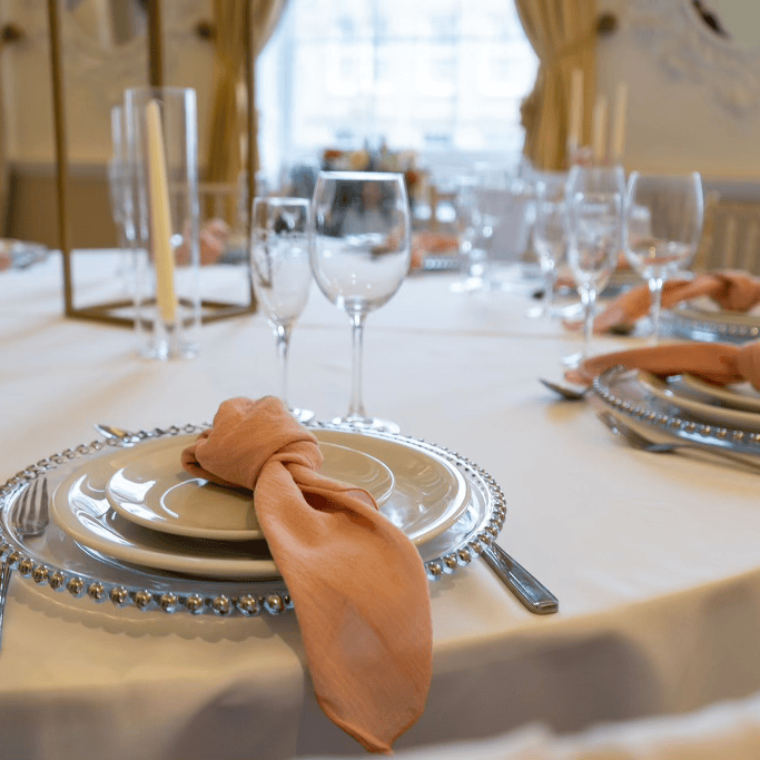 Blush pink accents on a table laid in our Grand Salon, showcasing its grandeur fit for a stunning and intimate Wedding Reception. 